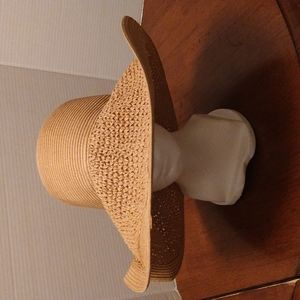 NWOT. Large straw sun hat. Tan in color.